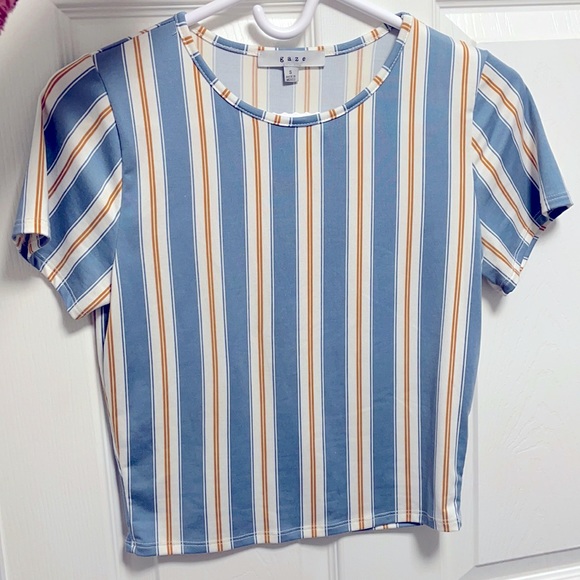 Very soft never worn t-shirt. Not too long but also not cropped too short.